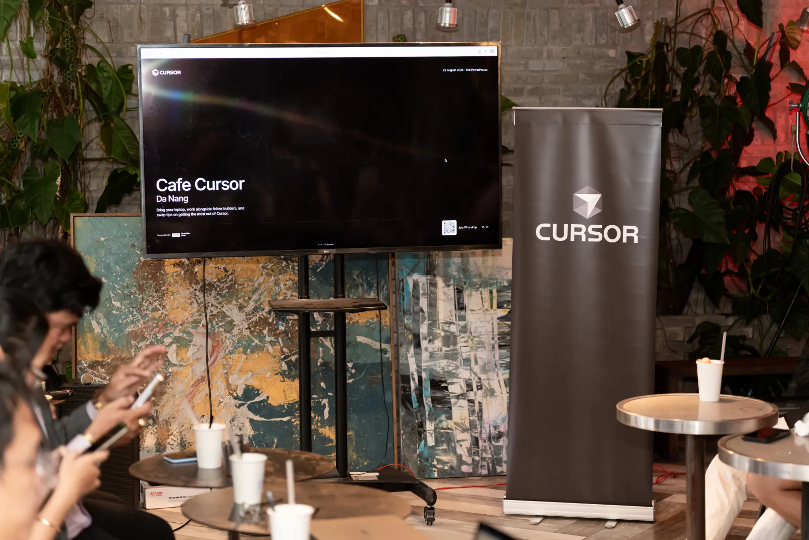 Cafe Cursor Da Nang title slide on the screen at The PowerHouse