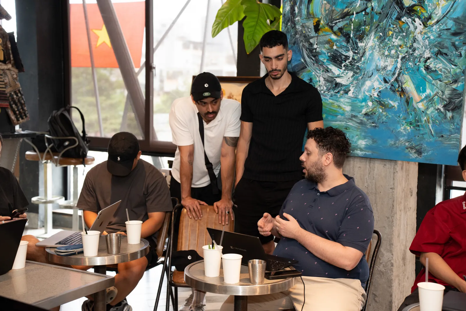 Attendees gathered around a laptop during the development tips session