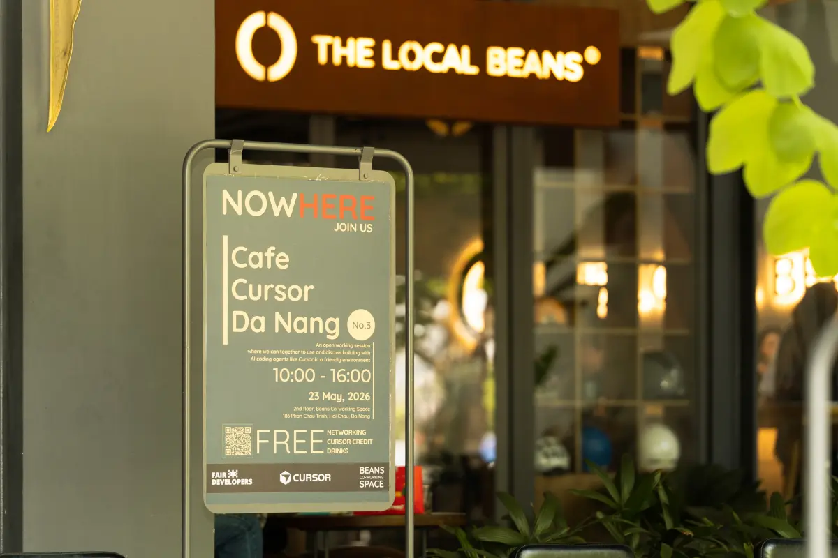 Cafe Cursor Da Nang No.3 event poster at the entrance of The Local Beans coworking cafe