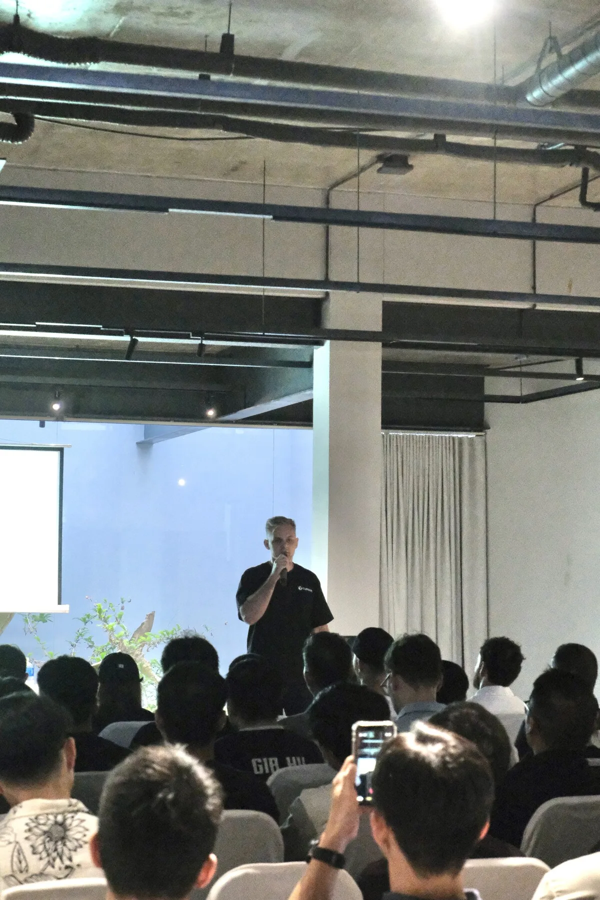 Nick Miller speaking to a packed room at the Cursor Da Nang Meetup