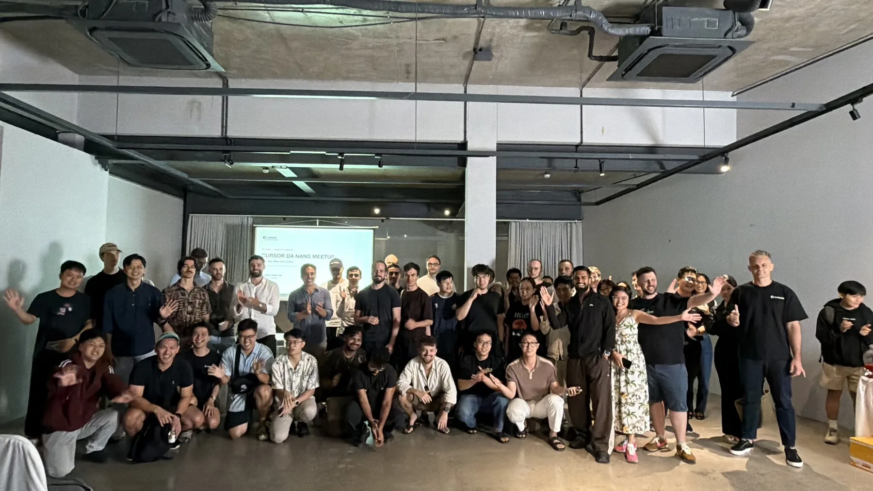 Full group photo of attendees at the Cursor Da Nang Meetup with Nick Miller at The Local Beans